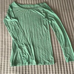 Medium bluish green long sleeve top.